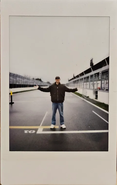 An instant photo standing on a race circuit