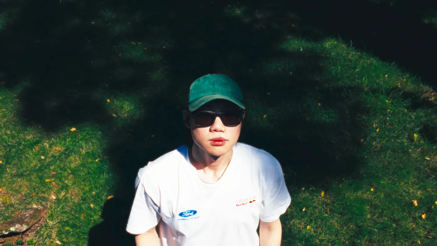 Ben Kim in sunlight and tree shadows